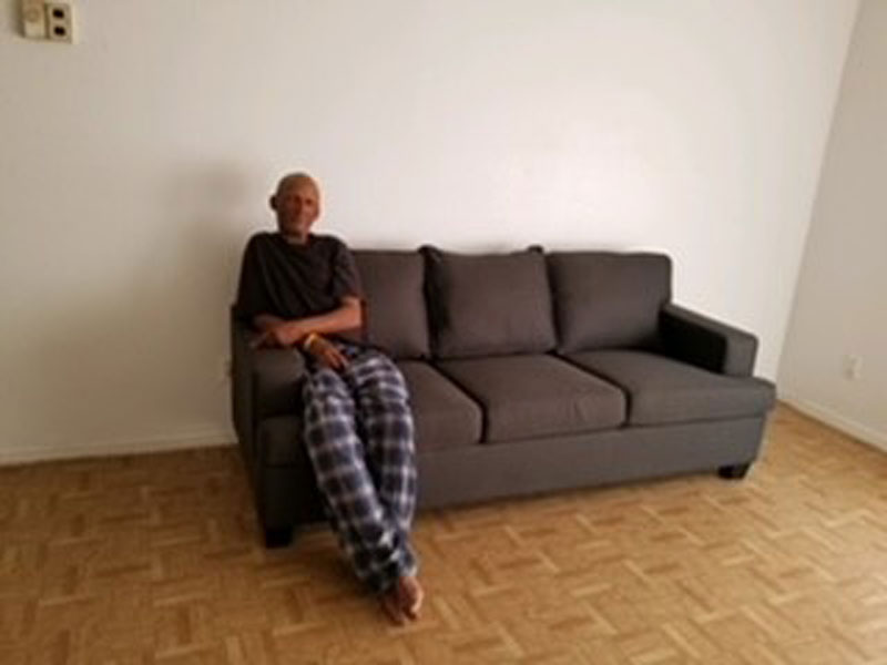 man sitting on couch