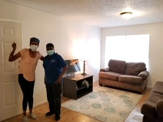 two people with furniture